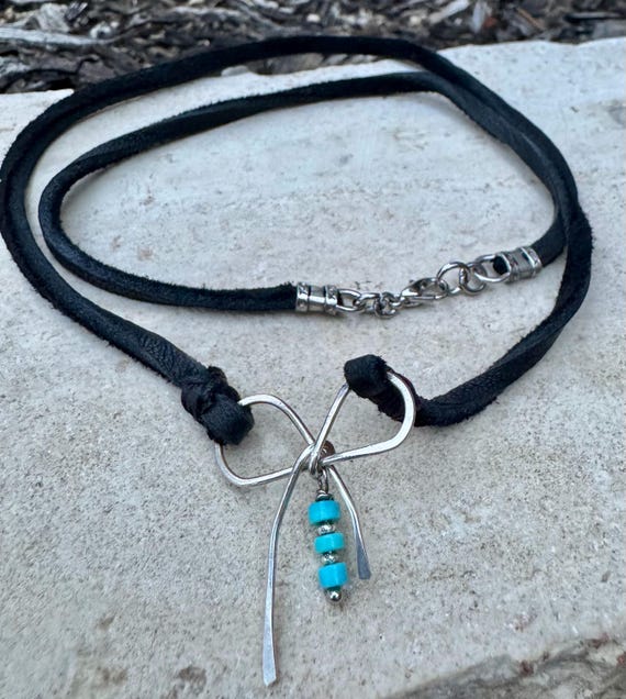 Dainty little silver handmade bow on genuine deerskin single leather lace with turquoise dangle