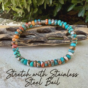 May include: A circular bracelet composed of small, round, multi-colored stone beads in shades of turquoise, orange, white, and brown, featuring a single silver-toned stainless steel bail bead. The text "Stretch with Stainless Steel Bail" is visible.