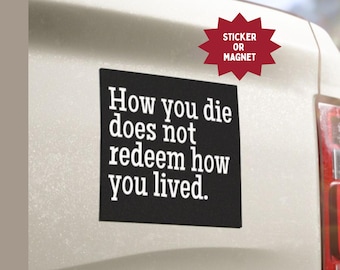 May include: A black rectangular sticker or magnet with white text that reads "How you die does not redeem how you lived." A red starburst shape above the sticker says "Sticker or Magnet."