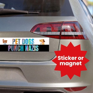 May include: A white and black car bumper sticker with the text "PET DOGS PUNCH NAZIS" and two cartoon dogs. The sticker is on a silver car. A red starburst sticker with the text "Sticker or magnet" is on the car.