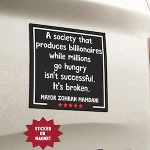May include: Black rectangular sticker or magnet with white text: "A society that produces billionaires while millions go hungry isn't successful. It's broken." Signed by Mayor Zohran Mamdani. Red starburst graphic at the bottom.
