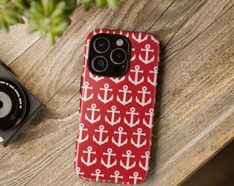 May include: A red phone case with a white anchor pattern. The case has a cutout for the camera lens.