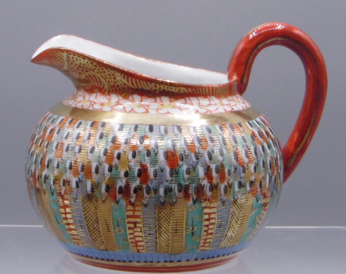 Porcelain Creamer Unknown Maker, Japan, Thousand Faces, Late Meiji Period 1900 - 1912