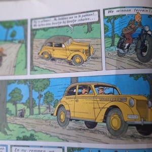 May include: Comic strip panels featuring a yellow car and a motorcycle racing on a road. The text in the speech bubbles reads "We win terrain!" and other Dutch phrases. The style is reminiscent of classic comic book art.