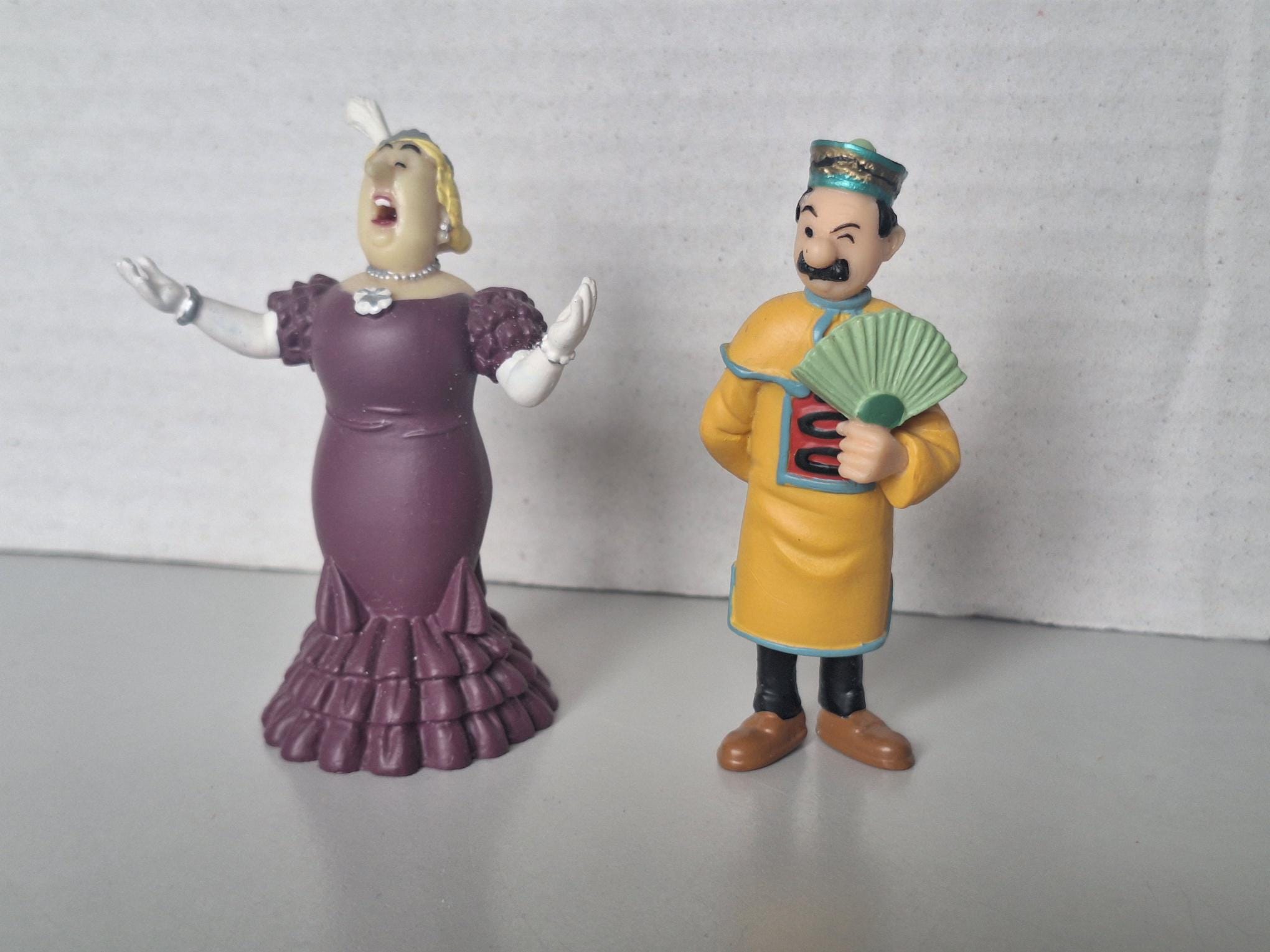 Dos figuritas de los álbumes de Tintín