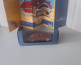 Un coche de Tintín del álbum: Tierra de Oro Negro