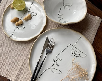 Geschirrset mit abstraktem Gesichtsmotiv, skulpturale Porzellanteller und -schalen, modernes Kunstgeschirr
