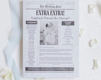 May include: A wedding announcement designed to look like a newspaper front page. The headline reads "EXTRA EXTRA! Kaitlyn & Patrick Are Married!" with a photo of the couple. White flower petals and a blue ribbon surround the announcement.