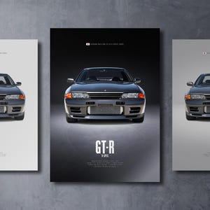 May include: A vertical poster featuring a dark gray Nissan Skyline GT-R V-Spec (R32) centered on a black background. The text GT-R V-SPEC appears below the car, accompanied by technical specifications and a small Japanese flag icon at the top.