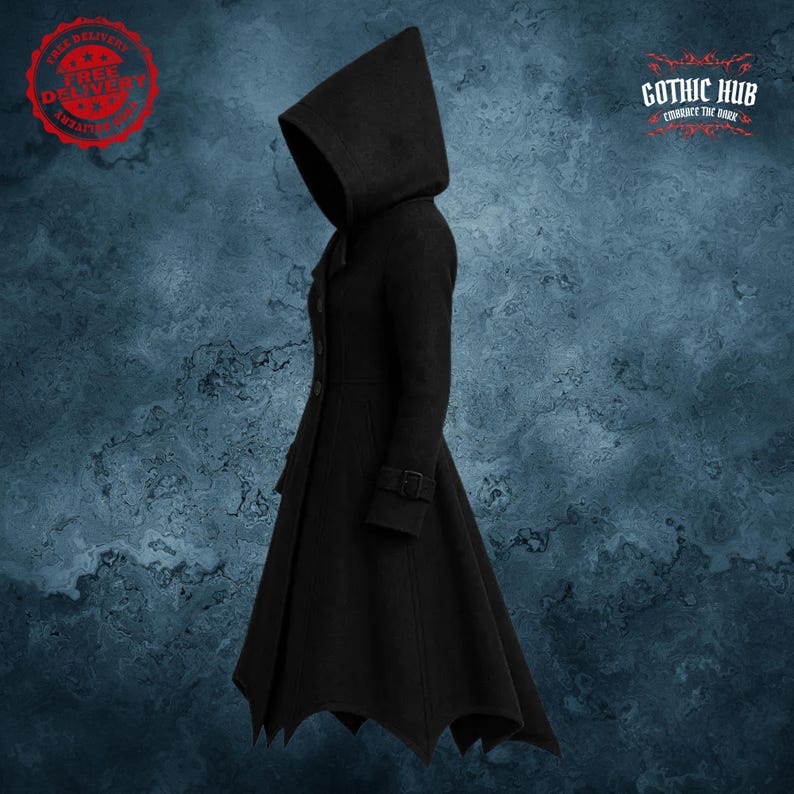 May include: Black hooded coat with a unique batwing hemline. The coat features a button-up front, a belt detail at the waist, and a large hood. The Gothic Hub logo is visible in the upper right corner. The coat is made of a dark, possibly wool, material.