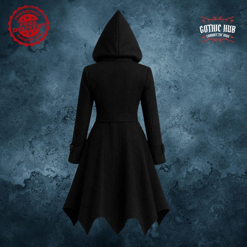 May include: A black hooded coat with a flared skirt and a belt at the waist. The coat has long sleeves and a pointed hemline. The image includes the text "GOTHIC HUB" and "FREE DELIVERY".