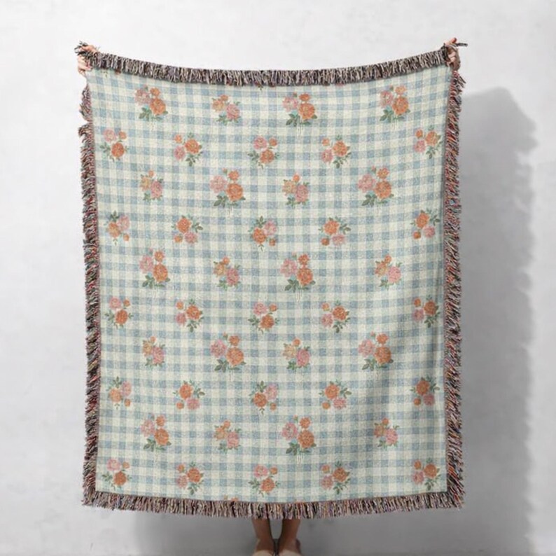 Floral gingham woven blanket displayed flat showing vintage botanical design