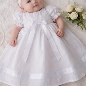 May include: A set of three ceramic mugs with a speckled, matte finish. The mugs are in shades of cream, light gray, and dark gray. Each mug has a simple, minimalist design and a rounded handle.