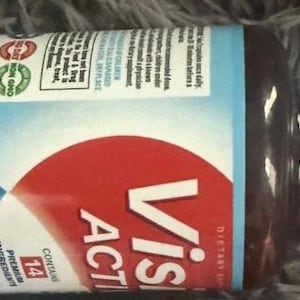 May include: A brown supplement bottle with a white lid. The label features the words "Visi Active" in white letters on a red background. The bottle contains 60 capsules and 14 premium ingredients.