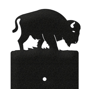 May include: Black metal light switch cover with a buffalo silhouette on top.