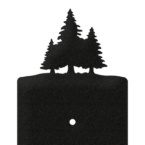 May include: Black light switch cover with a silhouette of three pine trees at the top.