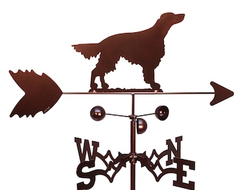 May include: A brown metal wind vane featuring a silhouette of a setter dog. The vane has a directional arrow and a compass rose with the letters W, S, E, and N.