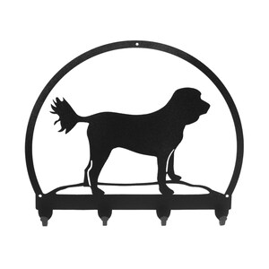 May include: Black metal key rack with a silhouette of a dog in a circle. The rack has five hooks.