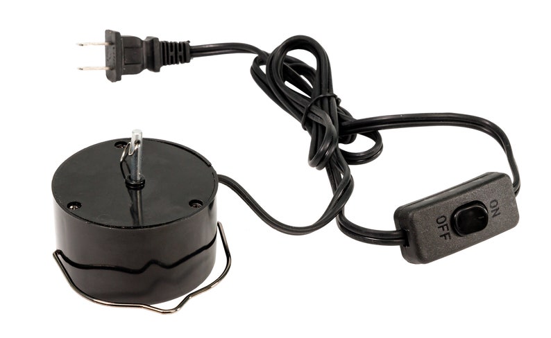 May include: Black electric motor with a cord and an on/off switch. The motor has a metal hook and a clear plastic rod.