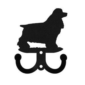 May include: Black metal double hook with a silhouette of a Cocker Spaniel dog.