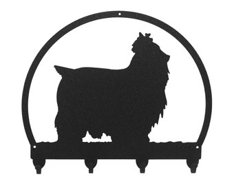 May include: Black metal Yorkshire Terrier silhouette key holder with a rounded top and three hooks.