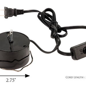 May include: Black electric rotating base with an on/off switch and a 52-inch cord. The base is 2.75 inches in diameter.