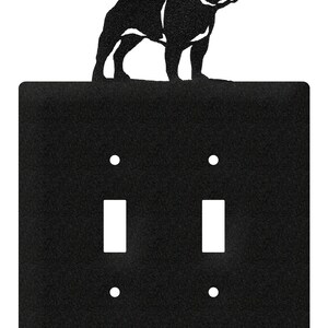 May include: Black metal light switch cover with a silhouette of a French Bulldog on top. The cover has two toggle switches and two screw holes.