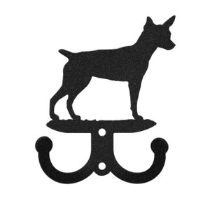 May include: Black metal double hook with a silhouette of a Rat Terrier dog.