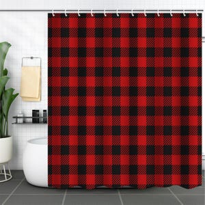 May include: Red and black checkered shower curtain. The curtain has a classic plaid pattern.