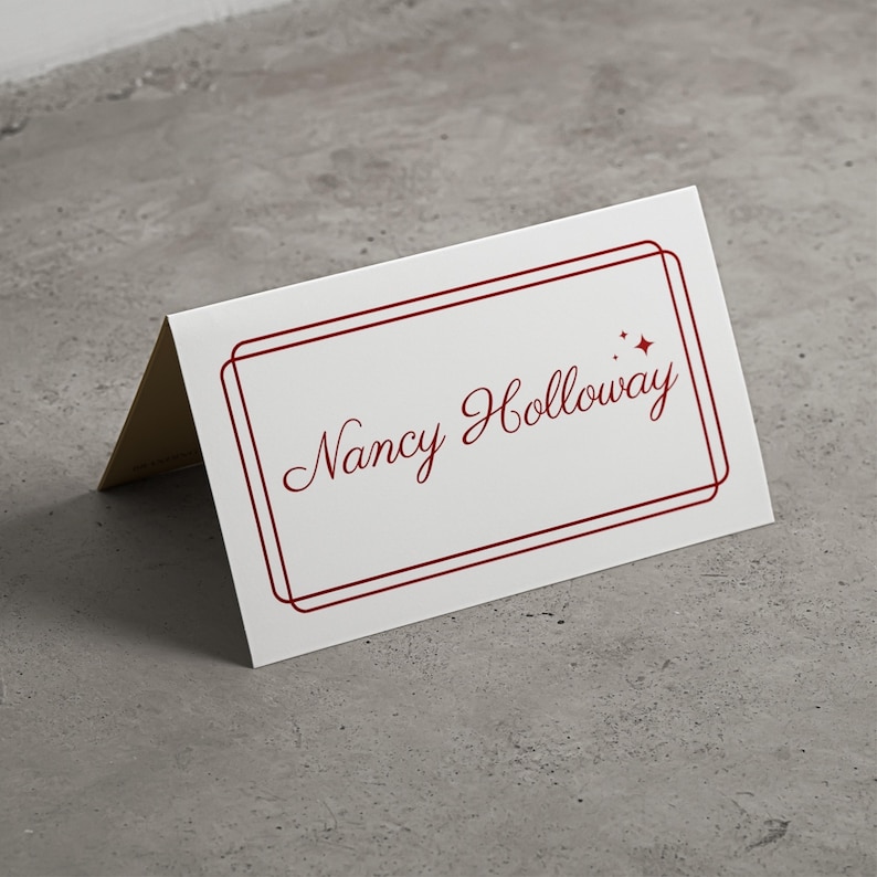 Classic folded name card, old money style, cream with deep red burgundy script writing and border.