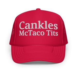 May include: A red trucker hat with white embroidered text that reads "Cankles McTaco Tits". The hat has a mesh back and a curved brim. The hat is a solid red color.