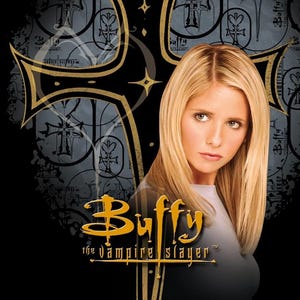 May include: Image shows a woman with blonde hair, set against a dark background with a cross design. The text "Buffy the Vampire Slayer" is displayed in gold lettering, with the show's logo.