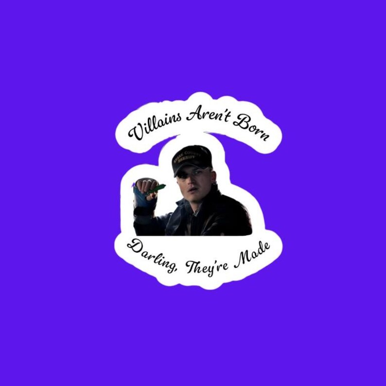 May include: A sticker with a purple background featuring a man wearing a black hat and jacket. The sticker has the text "Villains Aren't Born Darling, They're Made" in a white, cursive font.