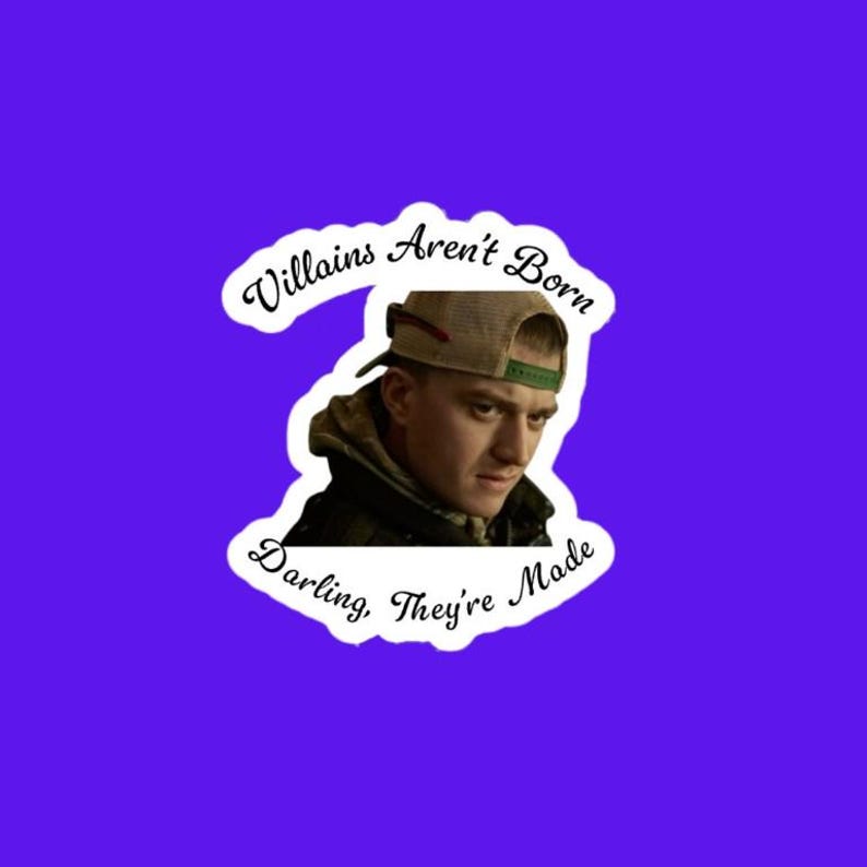 May include: A sticker on a purple background features a man wearing a cap and a hooded jacket. The sticker has the text "Villains Aren't Born Darling, They're Made" in a decorative font.