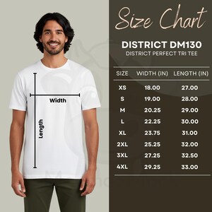 May include: A white District DM130 Perfect Tri Tee is shown on a person. A size chart is displayed, showing measurements in inches for sizes XS to 4XL. The chart includes width and length dimensions for each size.
