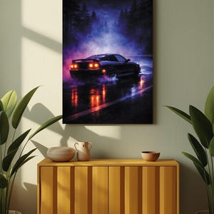 May include: A framed canvas print featuring a black sports car speeding on a wet road at night. The car's taillights glow red, reflecting on the asphalt. The background shows a dark forest with a purple and blue sky.
