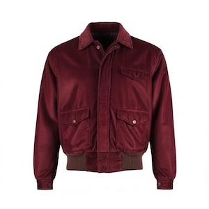 May include: A burgundy corduroy jacket with a brown collar and cuffs. The jacket has two front pockets with button closures and a button-up front. The jacket has a classic bomber style.