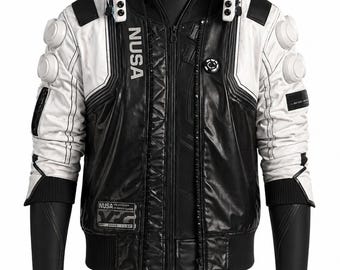May include: A black and white bomber jacket with the word "NUSA" printed vertically on the front. The jacket features a zip-up closure, multiple circular accents, and a ribbed hem. The sleeves are black with a textured design.