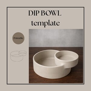 May include: A beige ceramic dip bowl with an attached smaller bowl. The text "DIP BOWL template" is displayed in black. A "Printable" label is in the upper left corner. The bowl sits on a dark wood surface.