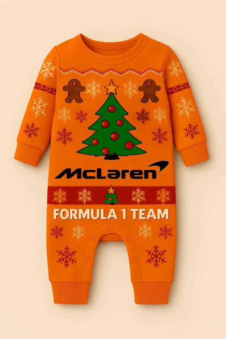 May include: Orange baby one-piece with a Christmas tree and gingerbread men design. Features the McLaren Formula 1 Team logo. Includes snowflake and star patterns. Made for infants.