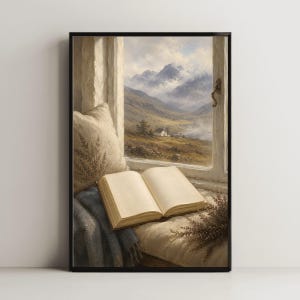 May include: An open book rests on a cream-colored cushion next to a blue blanket and a sprig of dried lavender. The scene is framed by a window looking out onto a landscape of rolling hills, a small house, and distant mountains under a cloudy sky.