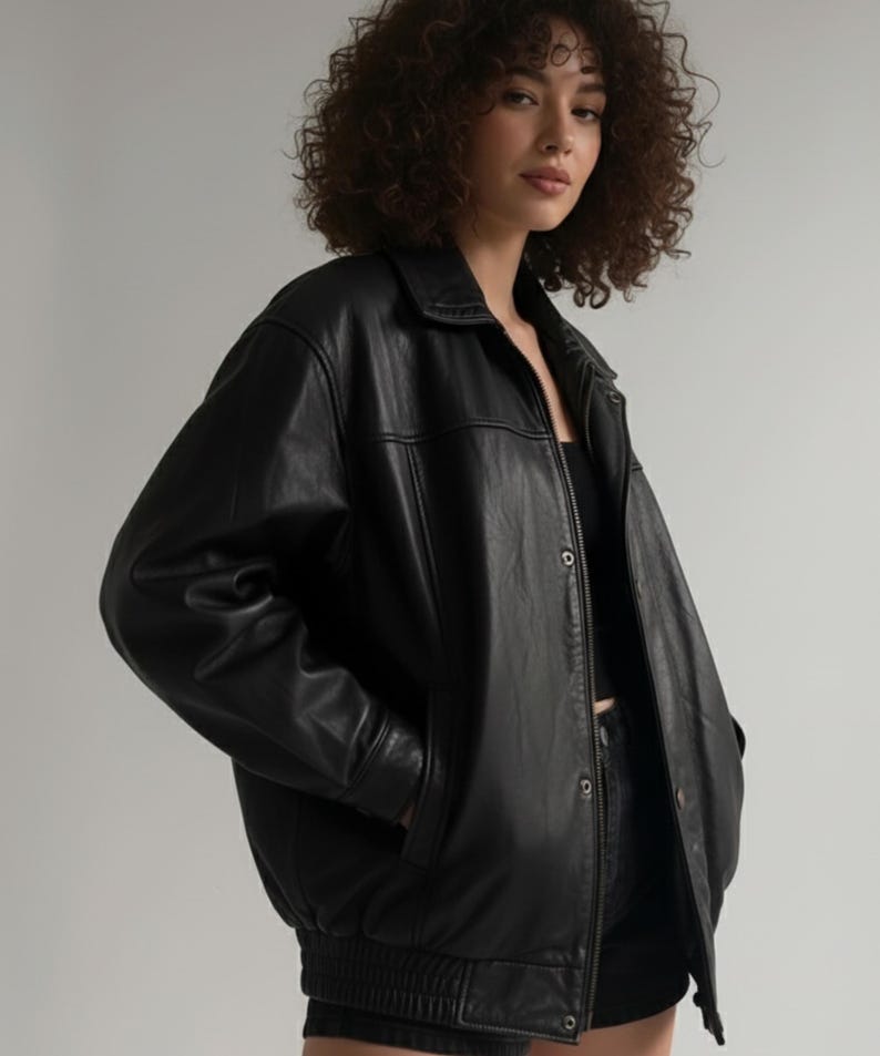 Classic Black Oversized Bomber Jacket for Women, Sheepskin Leather with Quilted Lining, 90s Style Winter Fashion.