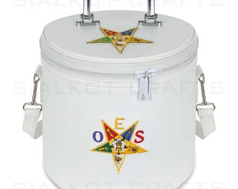May include: White, cylindrical cooler bag with a silver handle and zipper. Features embroidered star-shaped emblems with colorful details and the letters "OES". Includes a detachable shoulder strap.