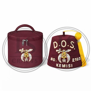 May include: Two burgundy items: a round travel bag with a handle and a fez hat. Both feature ornate gold and silver emblems. The fez hat has the text "D.O.S. NO. 2103 KEMISI" and a yellow tassel.