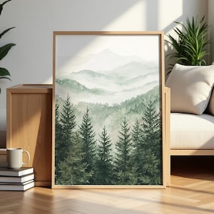 May include: A watercolour painting depicting a misty forest scene with a mountain range in the background. The painting features a variety of green trees and a soft, hazy atmosphere.