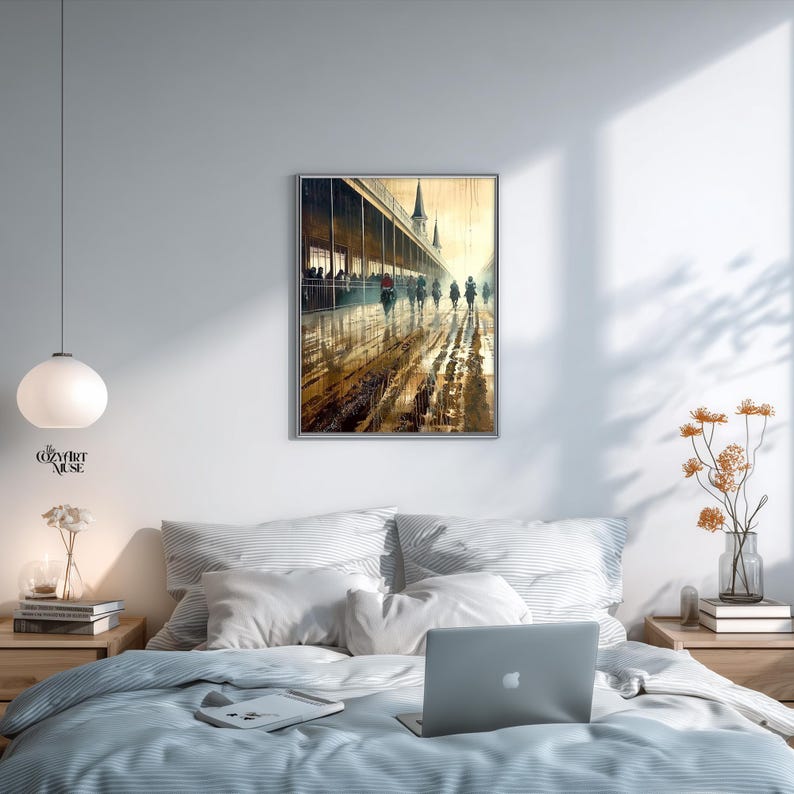 May include: A framed watercolor painting depicts a rainy day scene with figures walking along a covered walkway. The artwork features a muted color palette of browns, yellows, and grays, with reflections on the wet ground. The painting is displayed above a bed.
