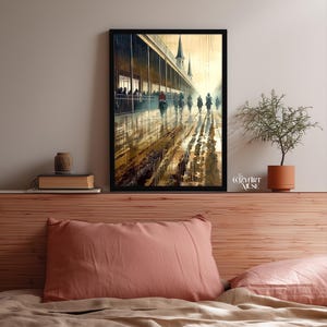 May include: Framed art print depicting a horse race in a wet, outdoor setting. The artwork features a long, covered structure with people watching the race. The track is wet, reflecting the horses and jockeys. The artwork is signed by "The Cozy Art Muse".