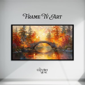 Puede incluir: Pintura de paisaje enmarcada que representa un puente de piedra sobre un río tranquilo, rodeado de árboles con vibrante follaje otoñal. La obra de arte presenta colores cálidos, con el texto "Frame Tv Art" en la parte superior y "the Cozy Art Muse" en la parte inferior.