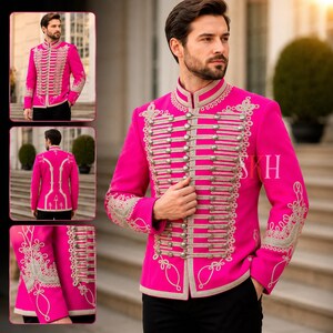 May include: A vibrant fuchsia jacket with intricate silver embroidery and button detailing. The jacket features a high collar and military-inspired design, with multiple rows of silver buttons and decorative trim. The sleeves and front panels are adorned with ornate silver embroidery.