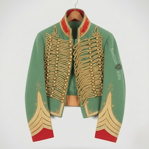 May include: A green military jacket with gold rope detailing and gold buttons. The jacket features red accents on the collar and cuffs. The sleeve displays the text "Scottish Kilts".
